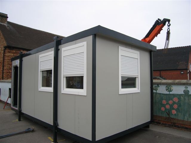 container showing white roller shutters