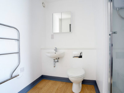 white toilet inside a container portable toilet